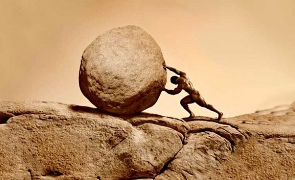 man-pushing-up-a-rock
